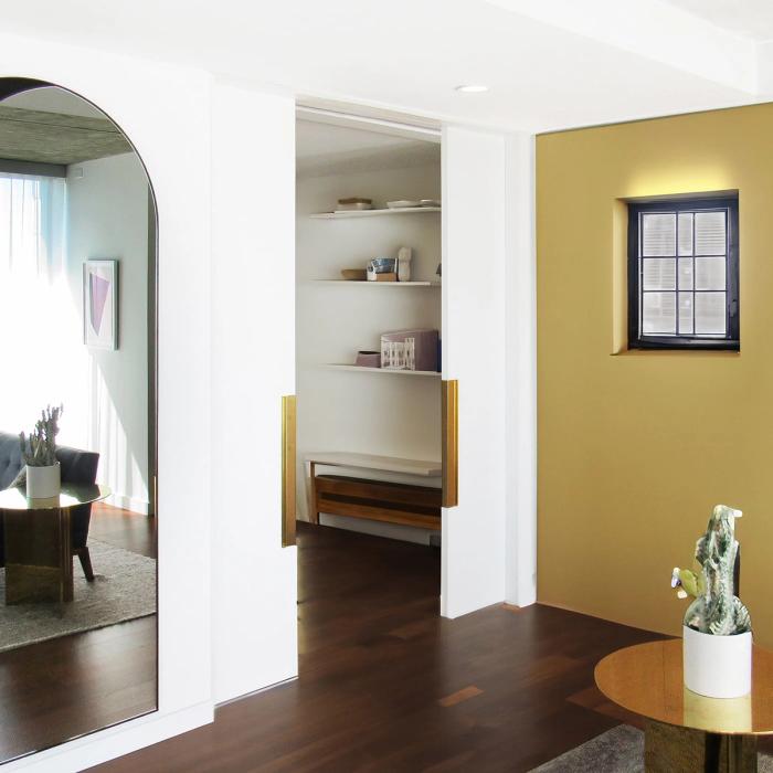 Open pocket door revealing the frame and track built into the wall cavity